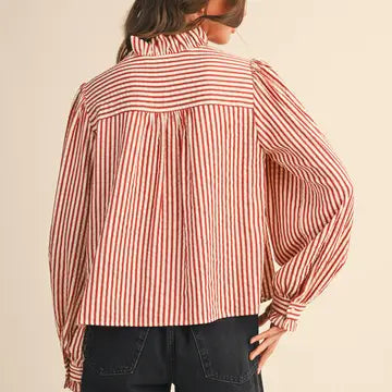 Back view of the &merci Striped Ruffle Blouse in red and cream stripes with long puff sleeves