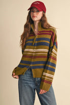 Woman wearing the &merci Striped Zip-Up Cardigan in avocado olive with navy, burgundy and cream stripes, front view