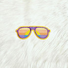 Embroidered patch of sunglasses with rainbow lenses on a white fabric background