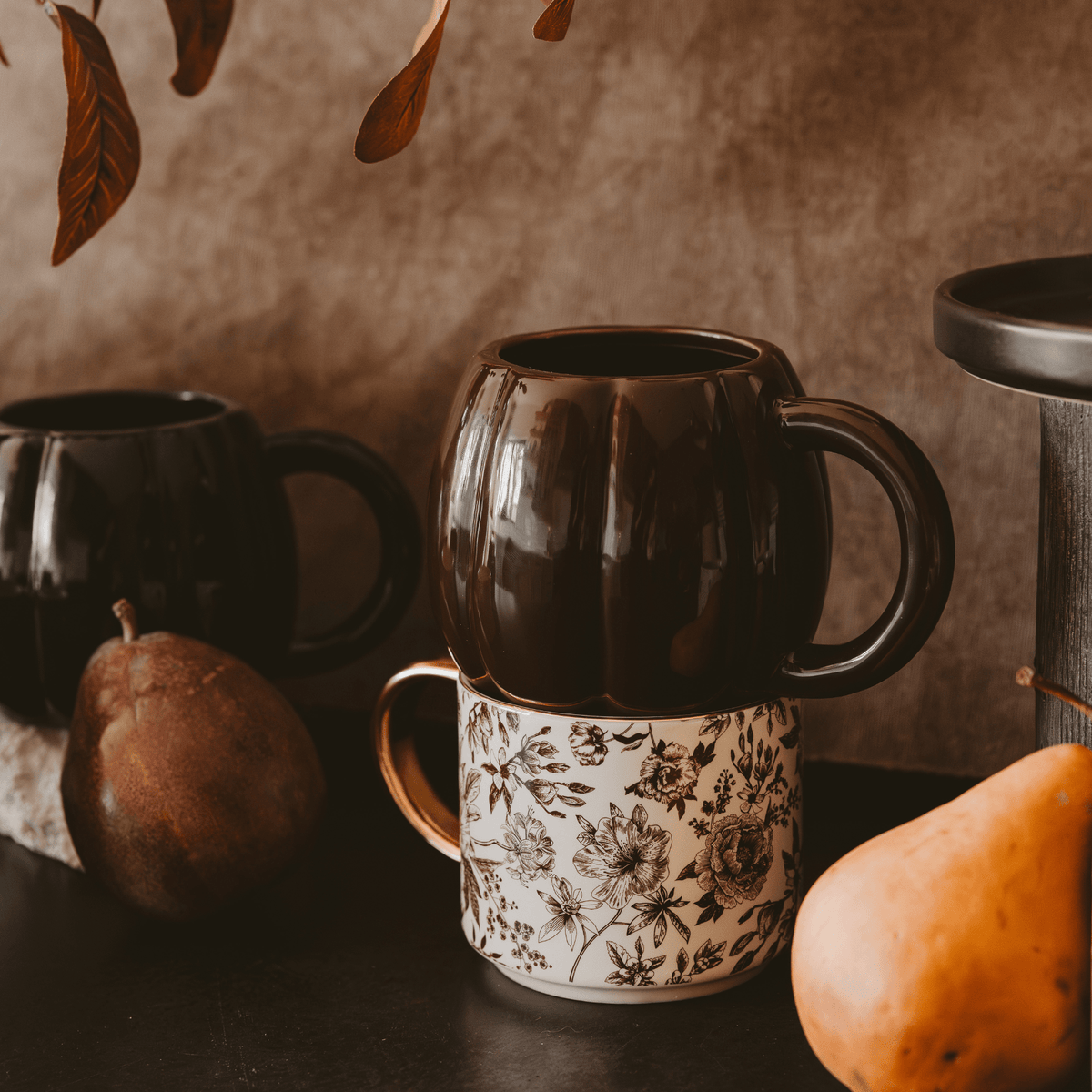 Brown pumpkin coffee mug styled for fall and Thanksgiving