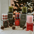 Sweet Water Decor boxed Christmas candles including Warm and Cozy under a tree