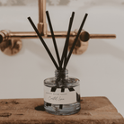 Coastal Lemon reed diffuser styled on a bathroom counter