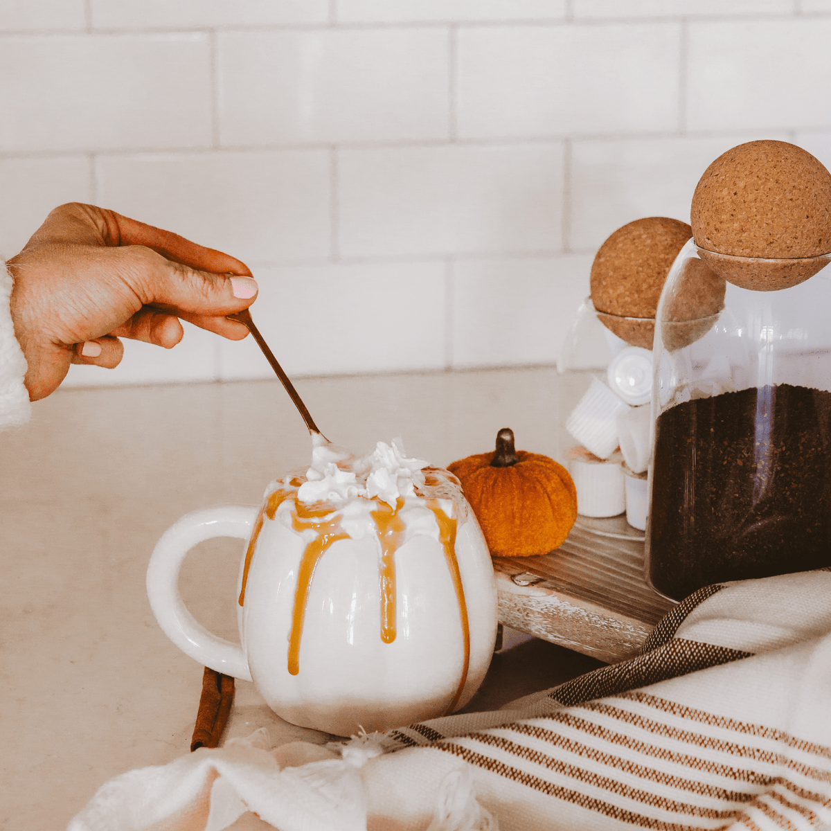 Cream pumpkin coffee mug with a latte styled for fall