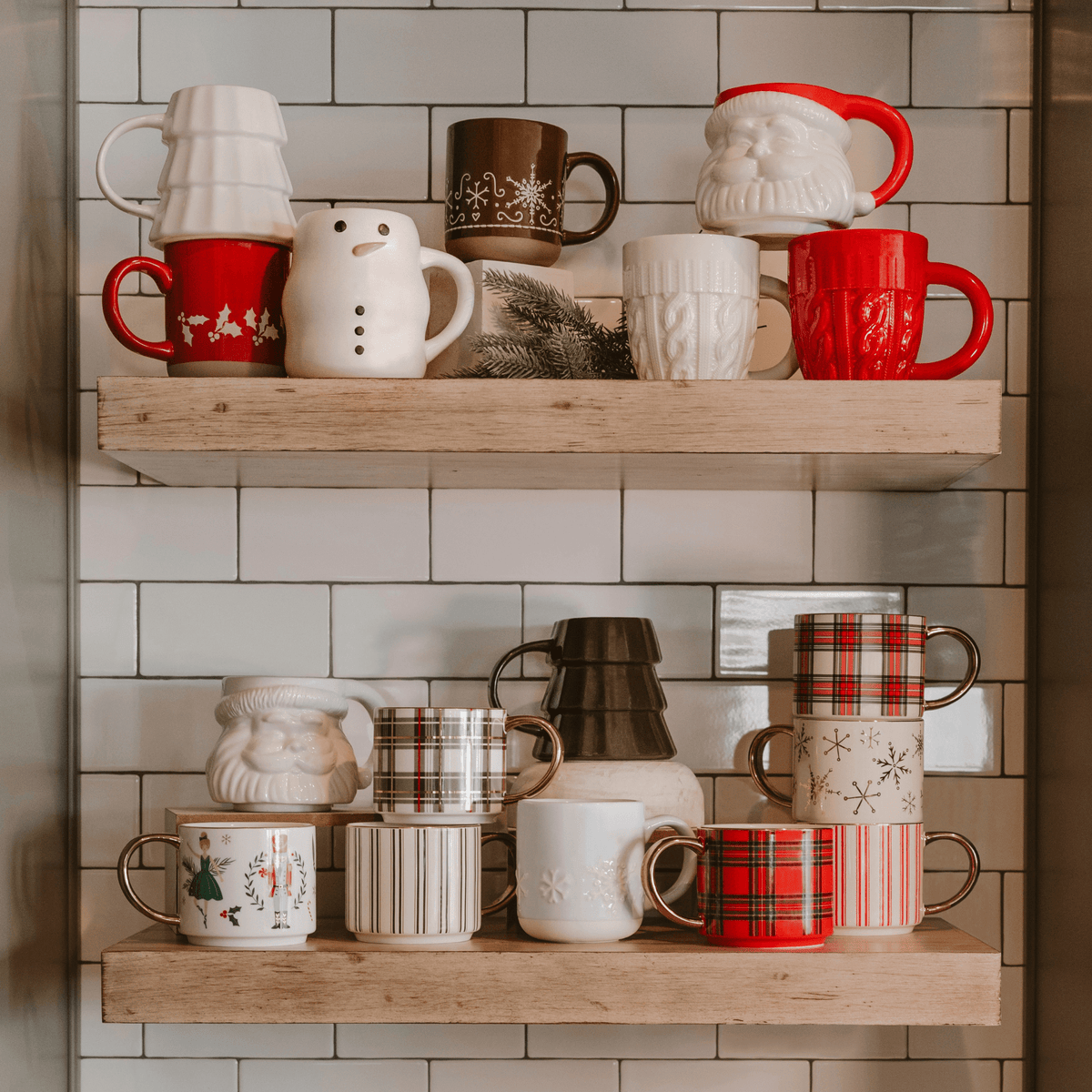 Sweet Water Decor holiday figurine mugs including the Cream Tree mug on a kitchen shelf