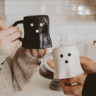 White and black ghost figurine coffee mugs for Halloween