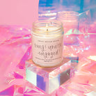 Sweet Water Decor OMG You're Engaged 9 oz soy candle styled on an iridescent backdrop, an engagement gift