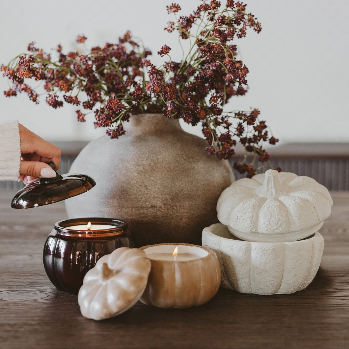 Sweet Water Decor pumpkin jar candles styled with fall branches