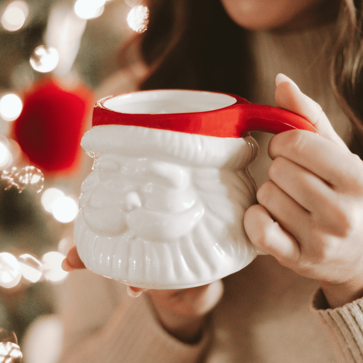 Red Hat Santa figurine coffee mug styled with Christmas lights