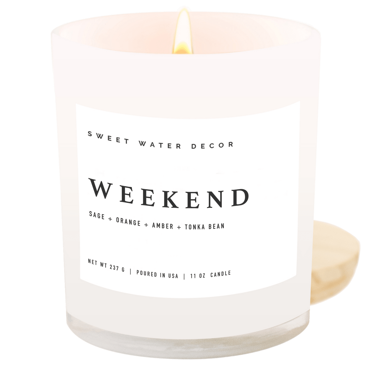 Sweet Water Decor Weekend 11 oz soy candle in a white jar with wood lid