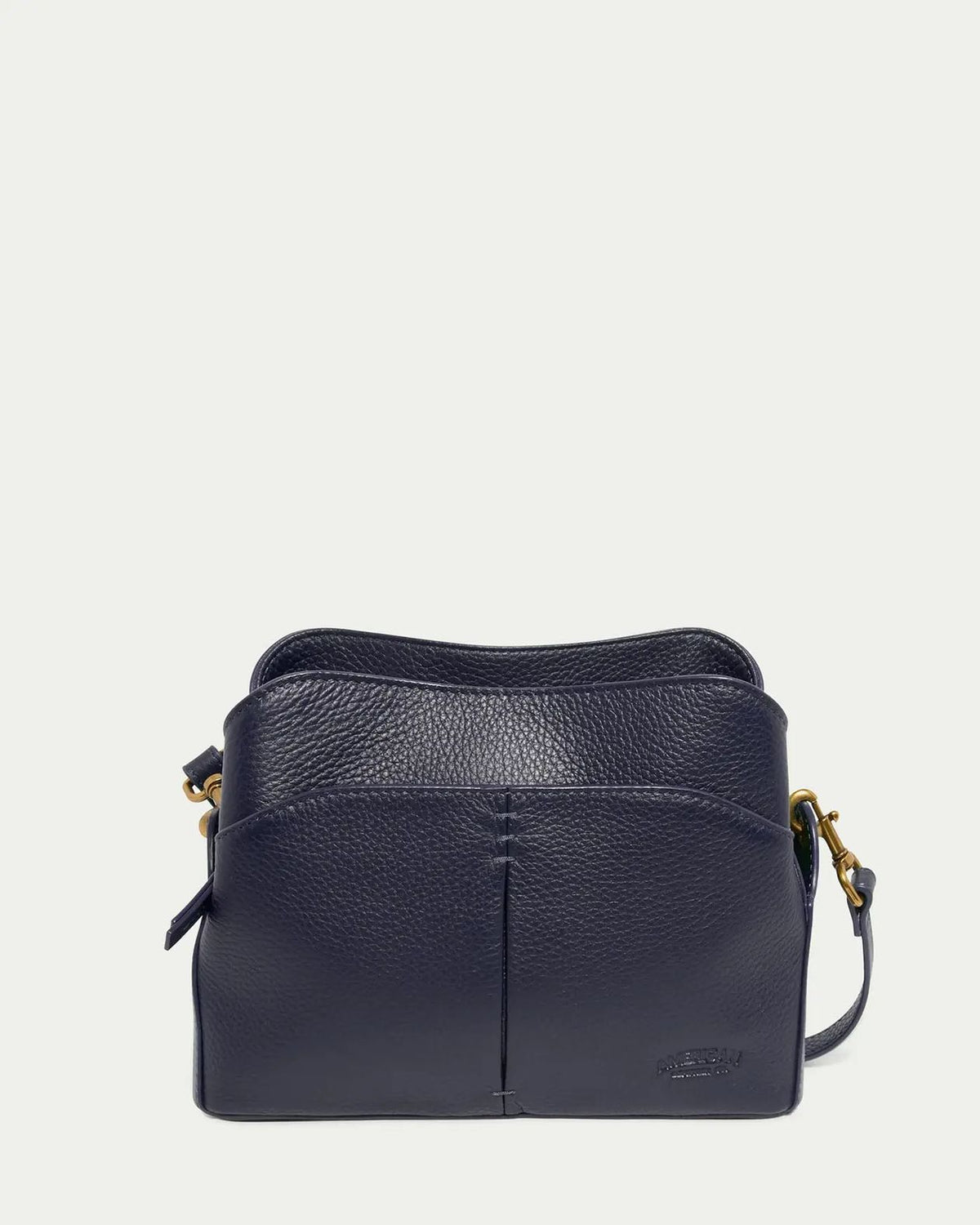 Navy leather crossbody bag on a light gray background