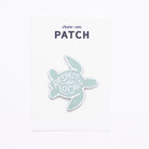 Turtle-shaped patch with 'Respect the Locals' text on a white background