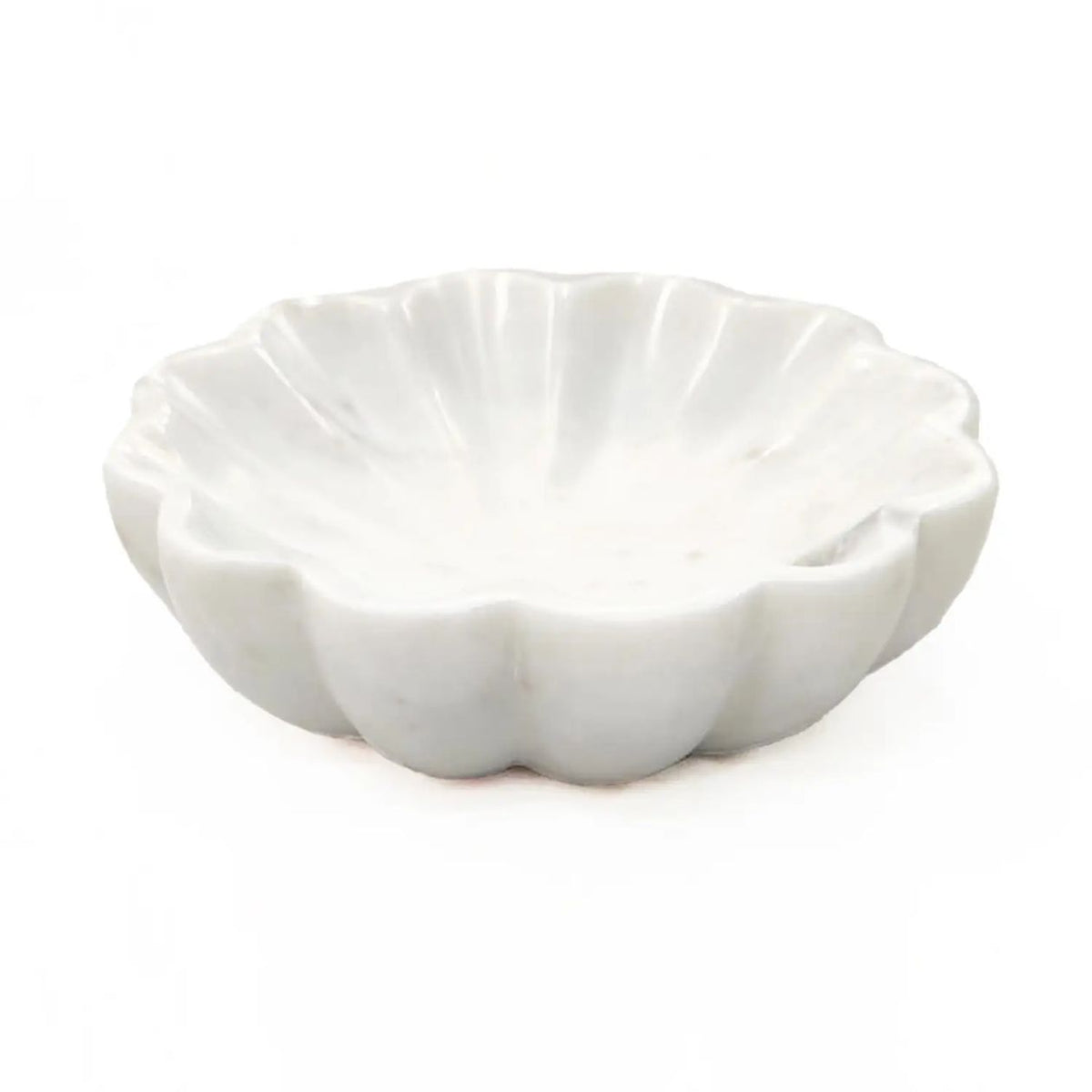 White marble flower-shaped trinket dish with scalloped petal edges on a white background
