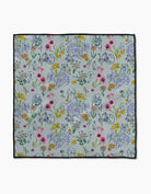 Wildflower Woof paw towel in soft blue-gray with multicolor wildflower print